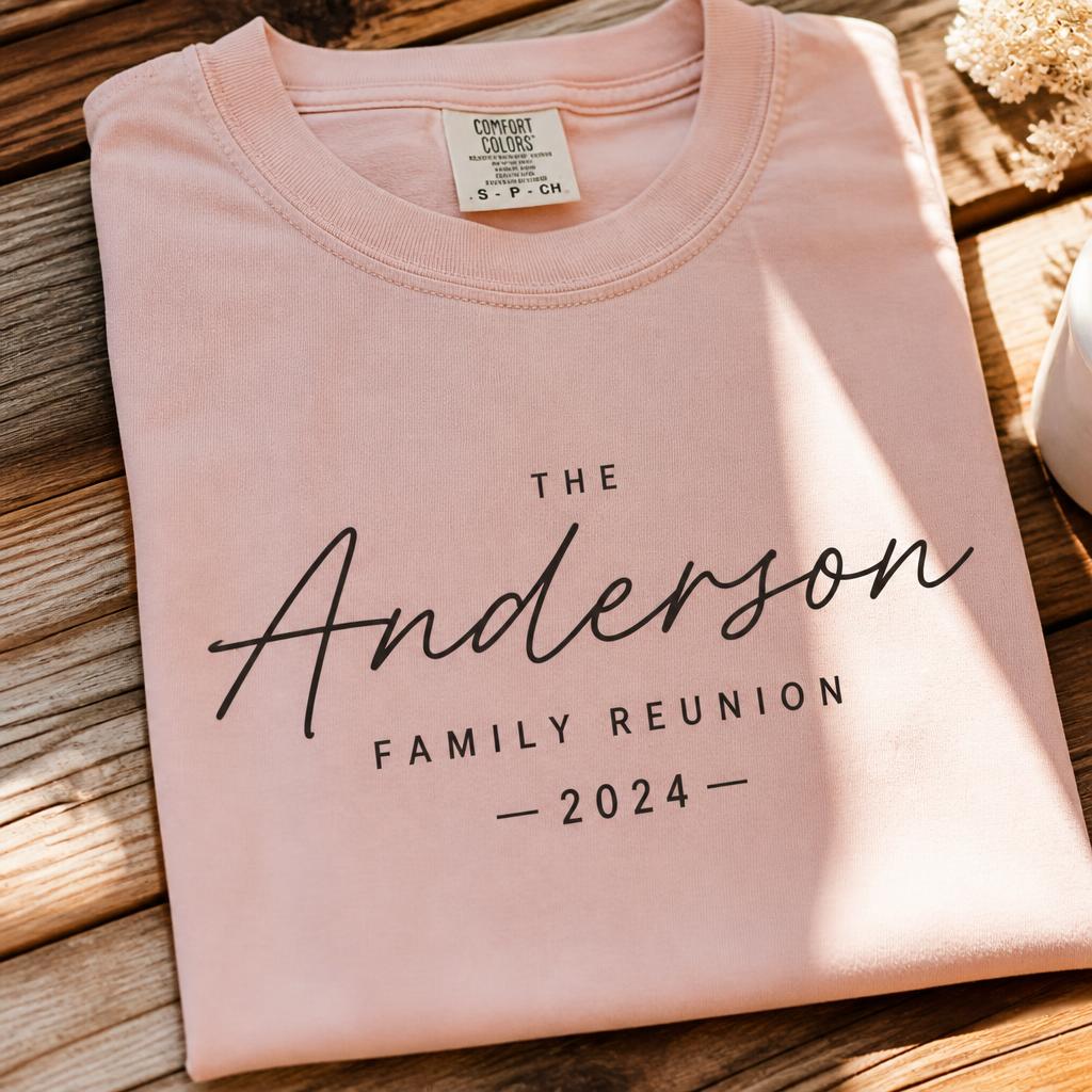 Blush pink family reunion tee on wooden table